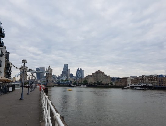 The view from Butler's Wharf looking back upstream of the Thames towards Tower Bridge and the City of London